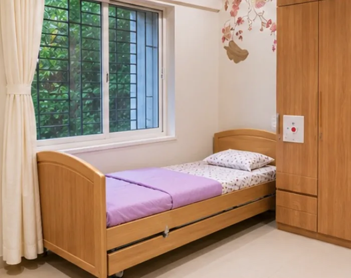 An elder-friendly bedroom with an adjustable bed and call bell